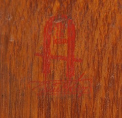 Gustav Stickley large 1 1/2" red decal with "Stickley" in a rectangle below the joiner's compass encompassing the motto: "Al ik Kan",  1902 - 1903. 